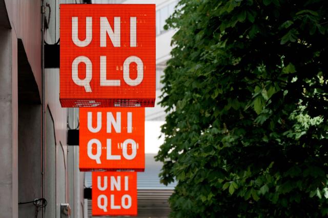 The logo of the Fast Retailing clothing brand Uniqlo is seen outside a branch in central Tokyo on April 9, 2026. (Photo by Kazuhiro NOGI / AFP)