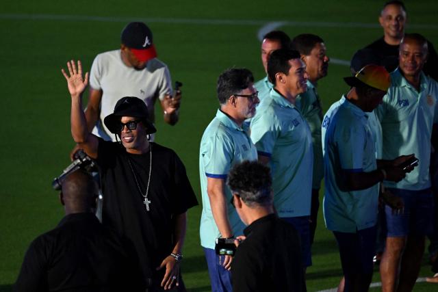 Brazilian former football player Ronaldinho waves to fans during the opening ceremony of the Legends Football Tournament Curacao in Willemstad on April 8, 2026. (Photo by Raul ARBOLEDA / AFP)