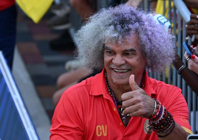Colombian former football player Carlos Valderrama smiles during the opening ceremony of the Legends Football Tournament Curacao in Willemstad on April 8, 2026. (Photo by Raul ARBOLEDA / AFP)