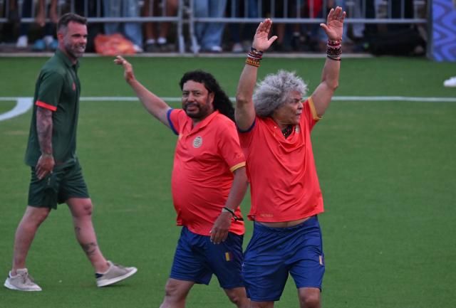 Colombian former football players Carlos Valderrama (R) and Rene Higuita (L) gesture during the opening ceremony of the Legends Football Tournament Curacao in Willemstad on April 8, 2026. (Photo by Raul ARBOLEDA / AFP)