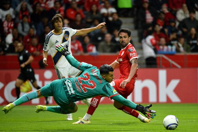 Toluca's goalkeeper #22 Luis Garcia looks at the ball during the CONCACAF Champions Cup quarterfinal football match between Mexico's Toluca and US' LA Galaxy, at the Nemesio Diez stadium in Toluca, state of Mexico, Mexico on April 9, 2026. (Photo by Mario VAZQUEZ / AFP)