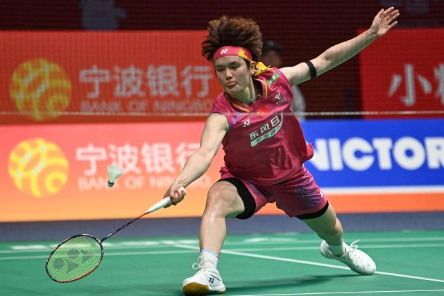 Wang Zhiyi of China hits a return to Pusarla V. Sindhu of India during their women's singles match at the Badminton Asia Championship in Ningbo, eastern China's Zhejiang province on April 9, 2026. (Photo by CN-STR / AFP) / China OUT