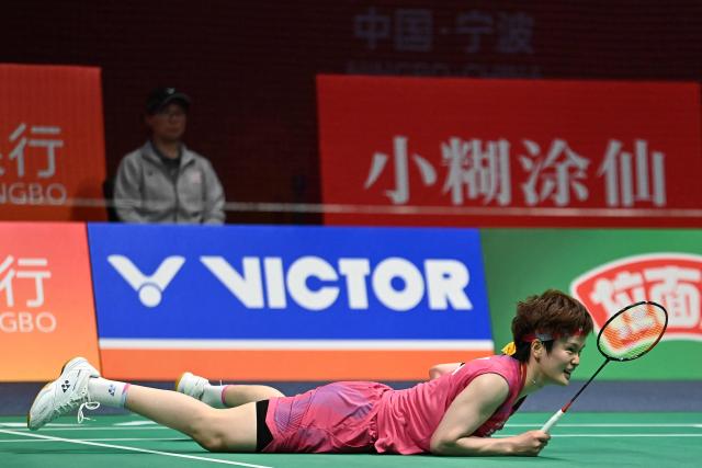 Wang Zhiyi of China reacts after a point against Pusarla V. Sindhu of India during their women's singles match at the Badminton Asia Championship in Ningbo, eastern China's Zhejiang province on April 9, 2026. (Photo by CN-STR / AFP) / China OUT