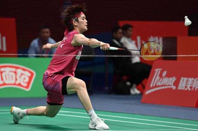 Wang Zhiyi of China hits a return to Pusarla V. Sindhu of India during their women's singles match at the Badminton Asia Championship in Ningbo, eastern China's Zhejiang province on April 9, 2026. (Photo by CN-STR / AFP) / China OUT