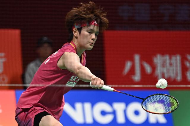 Wang Zhiyi of China hits a return to Pusarla V. Sindhu of India during their women's singles match at the Badminton Asia Championship in Ningbo, eastern China's Zhejiang province on April 9, 2026. (Photo by CN-STR / AFP) / China OUT