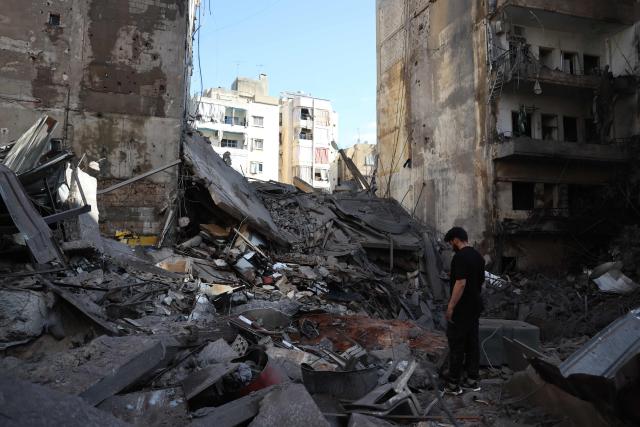 This picture taken on April 9, 2026, shows a man standing at the site of the previous day's Israeli airstrikes that targeted the Shiah area in the southern suburbs of Beirut. The Israeli military said it struck a Hezbollah commander in Beirut on April 8, after Lebanese state media reported that Israel had targeted a residential neighbourhood in the capital. (Photo by Anwar AMRO / AFP)