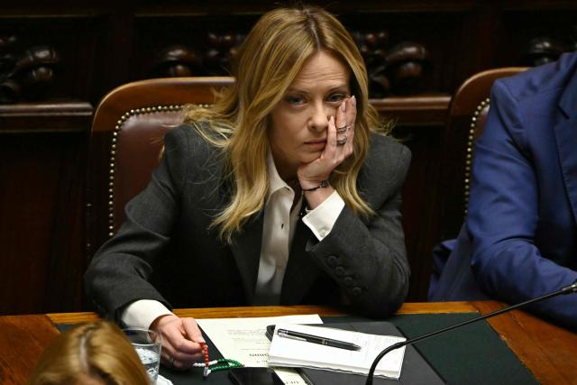 Italy's Prime Minister, Giorgia Meloni listens to the secretary of the Democratic Party (PD) Elly Schlein at the lower house of the Italian Parliament, in Rome on April 9, 2026. (Photo by Andreas SOLARO / AFP)