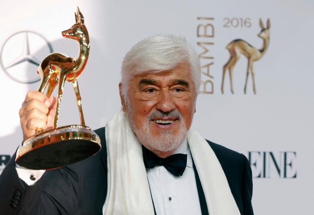 (FILES) German actor Mario Adorf poses for photographers with his trophy at the Bambi awards on November 17, 2016 in Berlin. Actor Mario Adorf has died at the age of 95 on April 8, 2026, his longtime manager Michael Stark announced on April 9, 2026. He “passed away in his sleep in his apartment in Paris on Wednesday after a short illness,” he said. (Photo by Axel SCHMIDT / AFP)