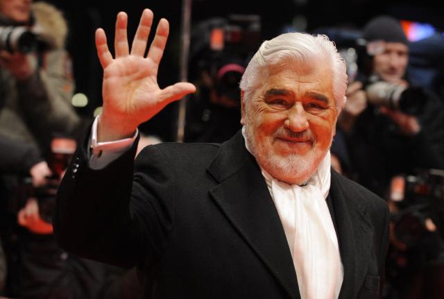 (FILES) German actor Mario Adorf waves as he arrives for the premiere of the film "Apart Together" competing in the 60th Berlinale Film Festival in Berlin February 11, 2010. Actor Mario Adorf has died at the age of 95 on April 8, 2026, his longtime manager Michael Stark announced on April 9, 2026. He “passed away in his sleep in his apartment in Paris on Wednesday after a short illness,” he said. (Photo by John MACDOUGALL / AFP)