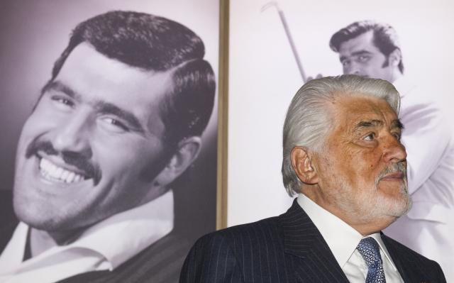 (FILES) German/Italian actor Mario Adorf poses for photographers in front of a wall of photographs retracing his film career prior to the official opening of the exhibition "Mario Adorf, boese kann ich auch" ("I can also play the bad guy") at the Berlin Art Academy February 1, 2012. Actor Mario Adorf has died at the age of 95 on April 8, 2026, his longtime manager Michael Stark announced on April 9, 2026. He “passed away in his sleep in his apartment in Paris on Wednesday after a short illness,” he said. (Photo by John MACDOUGALL / AFP)