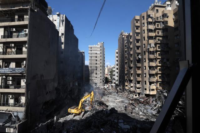 Lebanese first responders use a digger to search under the rubble at the site of an Israeli airstrike that targeted a building the day before in Beirut's Corniche al-Mazraa neighbourhood on April 9, 2026. Rescuers searched for survivors under the rubble of destroyed buildings in Beirut as Lebanon observed a day of mourning after Israeli strikes across the country killed more than 200. (Photo by Ibrahim AMRO / AFP)