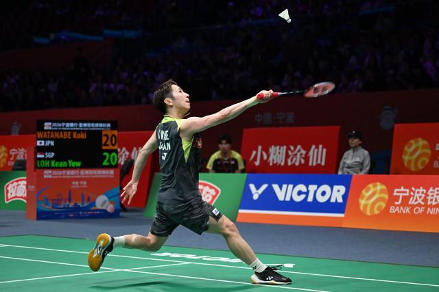 Koki Watanabe of Japan hits a return to Loh Kean Yew of Singapore during their men's single match at the Badminton Asia Championship in Ningbo, eastern China's Zhejiang province on April 9, 2026. (Photo by CN-STR / AFP) / China OUT