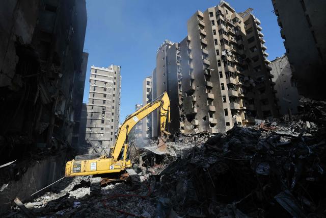 Lebanese first responders use a digger to search under the rubble at the site of an Israeli airstrike that targeted a building the day before in Beirut's Corniche al-Mazraa neighbourhood on April 9, 2026. Rescuers searched for survivors under the rubble of destroyed buildings in Beirut as Lebanon observed a day of mourning after Israeli strikes across the country killed more than 200. (Photo by Ibrahim AMRO / AFP)