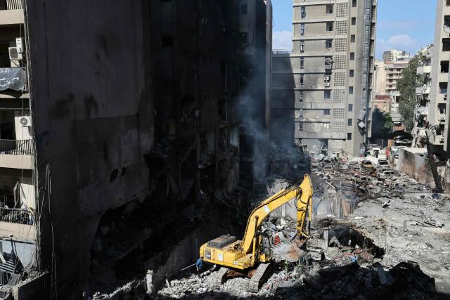 Lebanese first responders use a digger to search under the rubble at the site of an Israeli airstrike that targeted a building the day before in Beirut's Corniche al-Mazraa neighbourhood on April 9, 2026. Rescuers searched for survivors under the rubble of destroyed buildings in Beirut as Lebanon observed a day of mourning after Israeli strikes across the country killed more than 200. (Photo by Ibrahim AMRO / AFP)