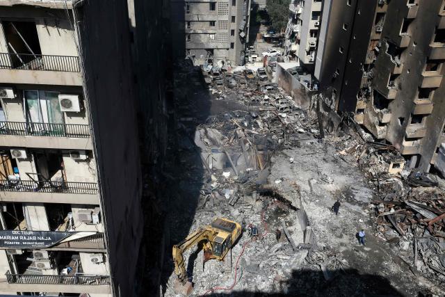 Lebanese first responders use a digger to search under the rubble at the site of an Israeli airstrike that targeted a building the day before in Beirut's Corniche al-Mazraa neighbourhood on April 9, 2026. Rescuers searched for survivors under the rubble of destroyed buildings in Beirut as Lebanon observed a day of mourning after Israeli strikes across the country killed more than 200. (Photo by Ibrahim AMRO / AFP)