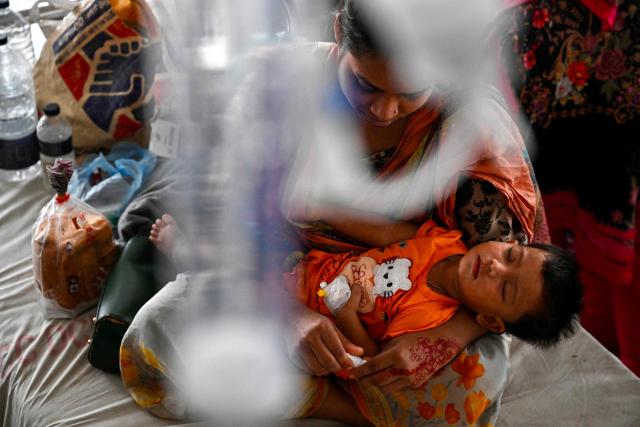A child diagnosed with measles receives treatment in a paediatric ward at a hospital in Dhaka on April 9, 2026. Bangladesh said it suspected measles killed at least 98 children in the past three weeks, official data showed on April 5, with Dhaka ramping up vaccination efforts in the worst-affected areas. (Photo by Munir UZ ZAMAN / AFP)