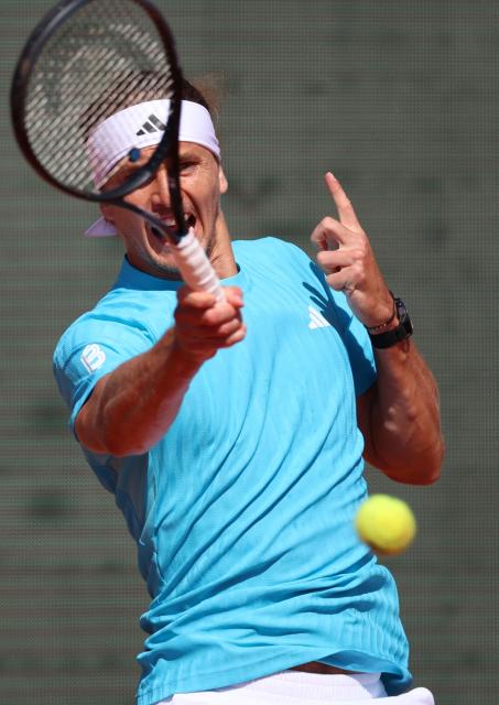Germany's Alexander Zverev plays a forehand return to Belgium's Zizou Bergs during their Monte Carlo ATP Masters Series Tournament round of 16 tennis match on Court Rainier III at the Monte-Carlo Country Club in Roquebrune-Cap-Martin, south-eastern France on April 9, 2026. (Photo by Valery HACHE / AFP)