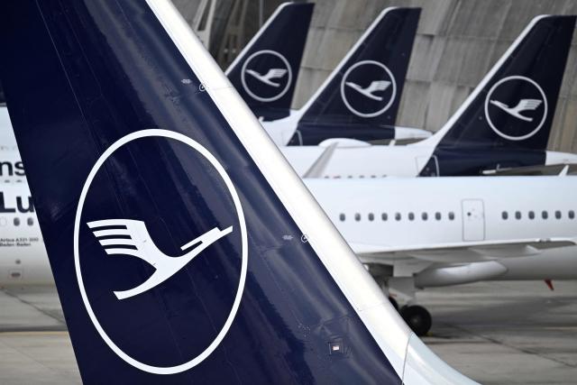 (FILES) The logo of German airline Lufthansa is seen on several aircraft parked on the tarmac at the international Frankfurt Airport, Frankfurt am Main, western Germany, on March 12, 2026. Cabin crew at German airline Lufthansa will go on strike on April 10, 2026 over an ongoing labour dispute, their union said. (Photo by Kirill KUDRYAVTSEV / AFP)