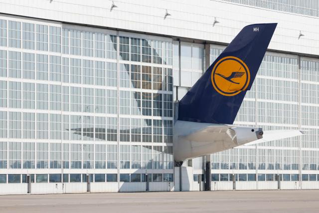 (FILES) The tale of a Lufthansa airplane sticks out of a hangar at the Franz Josef Strauss airport in Munich, southern Germany, on September 20, 2024. Cabin crew at German airline Lufthansa will go on strike on April 10, 2026 over an ongoing labour dispute, their union said. (Photo by Michaela STACHE / AFP)