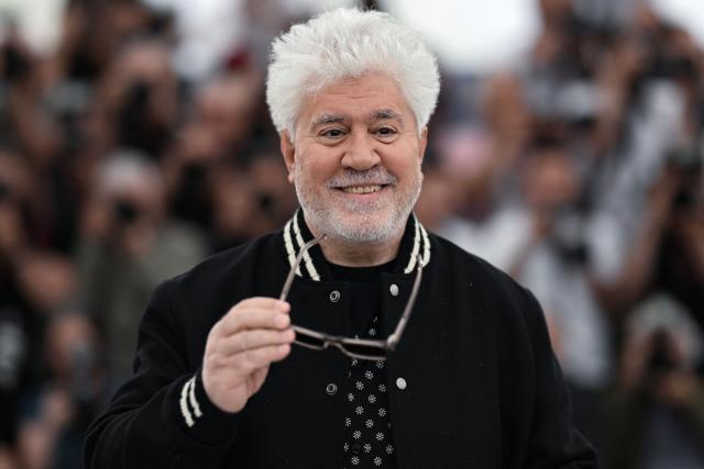 (FILES) Spanish film director Pedro Almodovar poses during a photocall for the film "Extrana Forma de Vida" (Strange Way of Life) at the 76th edition of the Cannes Film Festival in Cannes, southern France, on May 17, 2023. Iranian filmmaker Asghar Farhadi, Pedro Almodovar – making his seventh appearance in the competition – exiled Russian director Andrei Zvyagintsev, and previous winners Hirokazu Kore-eda and Cristian Mungiu will be vying for the Palme d’Or at the 79th Cannes Film Festival. The selection, announced on April 9, 2026, includes just one US director, Ira Sachs, whilst the major Hollywood studios are notably absent from this year’s festival, which will take place from May 12 to 23, 2026. (Photo by Patricia DE MELO MOREIRA / AFP)