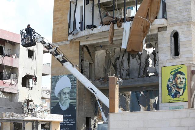 People inspect the site of an Israeli airstrike that targeted a religious Shiite complex the day before in the southern Lebanese coastal city of Sidon on April 9, 2026. Calls were mounting for the ceasefire between the US and Iran to be extended to Israel's war with Hezbollah, after a massive wave of Israeli strikes on Lebanon killed more than 200 people. (Photo by Mahmoud ZAYYAT / AFP)