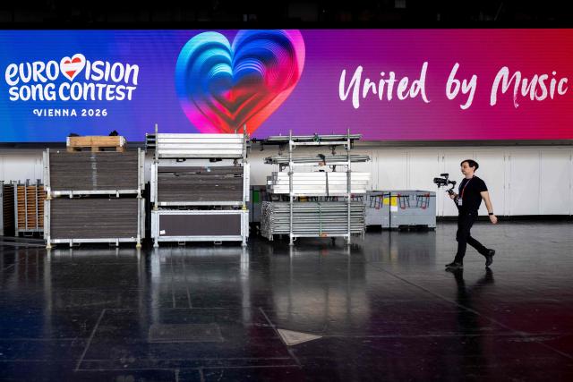 A jouranlist visits the Stadthalle as preparations are underway at the Eurovision Song Contest (ESC) venue in Vienna during a media tour on April 9, 2026. The Austrian capital Vienna will host the Eurovision Song Contest 2026 from May 12 to 16, 2026. (Photo by Joe Klamar / APA / AFP) / Austria OUT