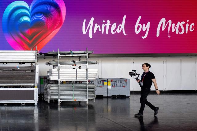 A jouranlist visits the Stadthalle as preparations are underway at the Eurovision Song Contest (ESC) venue in Vienna during a media tour on April 9, 2026. The Austrian capital Vienna will host the Eurovision Song Contest 2026 from May 12 to 16, 2026. (Photo by Joe Klamar / AFP) / ALTERNATIVE CROP