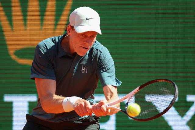 Italy's Jannik Sinner plays a backhand return to Czech Republic's Tomas Machac during their Monte Carlo ATP Masters Series Tournament round of 16 tennis match on Court Rainier III at the Monte-Carlo Country Club in Roquebrune-Cap-Martin, south-eastern France on April 9, 2026. (Photo by Valery HACHE / AFP)