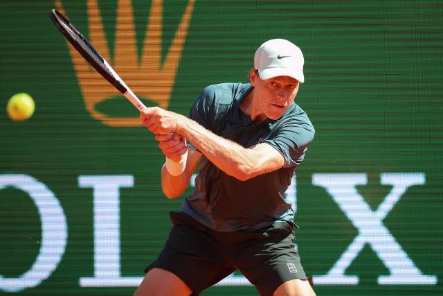 Italy's Jannik Sinner plays a backhand return to Czech Republic's Tomas Machac during their Monte Carlo ATP Masters Series Tournament round of 16 tennis match on Court Rainier III at the Monte-Carlo Country Club in Roquebrune-Cap-Martin, south-eastern France on April 9, 2026. (Photo by Valery HACHE / AFP)