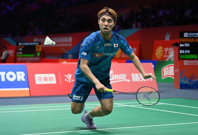 Kodai Naraoka of Japan hits a return to Alwi Farhan of Indonesia during their men's singles match at the Badminton Asia Championship in Ningbo, eastern China's Zhejiang province on April 9, 2026. (Photo by CN-STR / AFP) / China OUT