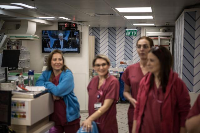 Midwifes gather during the morning rounds at the delivery room in the underground bomb shelter built into the Carmel Medical Center in the northern Israeli city of Haifa, on April 9, 2026. The hospital, built in the tip of the one of the mountains of the Carmel Mountain Range is part of the Clalit Health Services, the largest health organisation in Israel running 14 hospitals across the country. At least 14 rocket alerts sounded through April 9 morning in communities near Israel's northern border with Lebanon as Israeli forces fight Hezbollah despite the US-Iran ceasefire. (Photo by MARCO LONGARI / AFP)