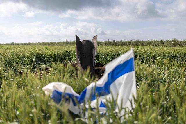 Remnats of an Iranian missile are pictured near the border between the Israeli-annexed Golan Heights and Syria on April 9, 2026. Israel vowed more strikes against Hezbollah on April 9, dismissing mounting international demands that the fragile truce between the United States and Iran in the Gulf be expanded to cover the war in Lebanon. (Photo by Ilia YEFIMOVICH / AFP)