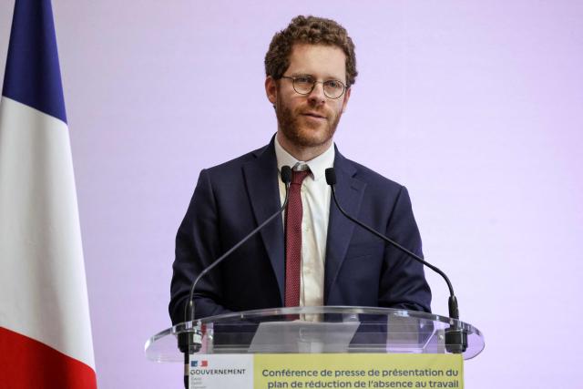 France's junior Minister for civil service David Amiel speaks during a press conference to present the plan to reduce absenteeism at work, in Paris on April 9, 2026. France's Health Minister confirmed to the National Assembly on April 1, 2026 that the government is preparing to announce measures to curb the current rise in sick pay, which is "no longer sustainable" for the National Health Service. This also includes making it easier for employers to monitor absenteeism and providing employers with guidelines on best practice regarding working conditions. (Photo by Ludovic MARIN / AFP)