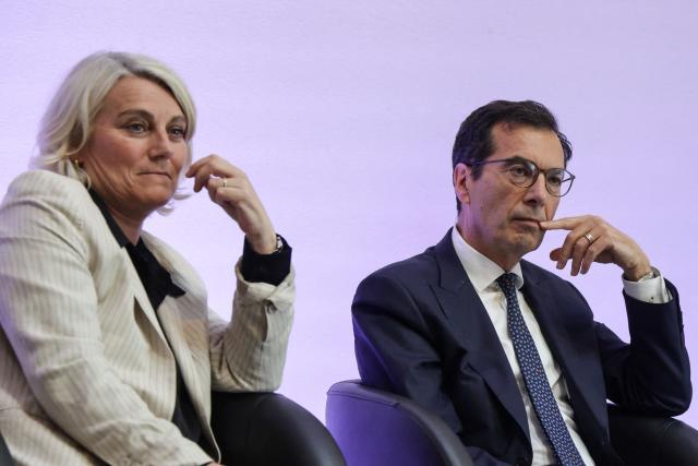 France's Health Minister Stephanie Rist (L) and France's Labour Minister Jean-Pierre Farandou (R) look on during a press conference to present the plan to reduce absenteeism at work, in Paris on April 9, 2026. France's Health Minister confirmed to the National Assembly on April 1, 2026 that the government is preparing to announce measures to curb the current rise in sick pay, which is "no longer sustainable" for the National Health Service. This also includes making it easier for employers to monitor absenteeism and providing employers with guidelines on best practice regarding working conditions. (Photo by Ludovic MARIN / AFP)
