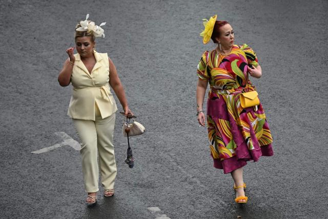 Racegoers attend the opening day of the Grand National Festival horse race meeting at Aintree Racecourse in Liverpool, north-west England, on April 9, 2026. (Photo by Paul ELLIS / AFP)