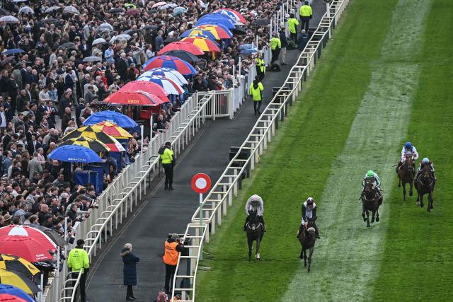 Mange Tout (2nd L) wins the 'Boodles Anniversary 4-Y-O Juvenile Hurdle' first race of the day on the opening day of the Grand National Festival horse race meeting at Aintree Racecourse in Liverpool, north-west England, on April 9, 2026. (Photo by Paul ELLIS / AFP)