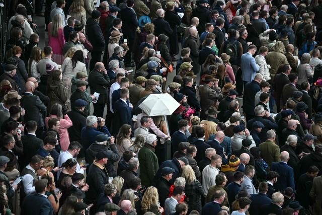 Racegoers watch the first race on the opening day of the Grand National Festival horse race meeting at Aintree Racecourse in Liverpool, north-west England, on April 9, 2026. (Photo by Paul ELLIS / AFP)