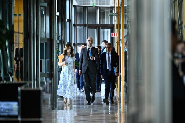 France's Government Spokesperson Maud Bregeon (L), France's Economy and Finance Minister Roland Lescure (C) and France's Trade Minister Serge Papin (R) arrive for a ministers meeting with fuel distributors at the Bercy finance ministry in Paris on April 9, 2026. (Photo by JULIEN DE ROSA / AFP)