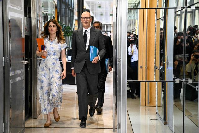 France's Government Spokesperson Maud Bregeon (L) and France's Economy and Finance Minister Roland Lescure arrive for a ministers meeting with fuel distributors at the Bercy finance ministry in Paris on April 9, 2026. (Photo by JULIEN DE ROSA / AFP)