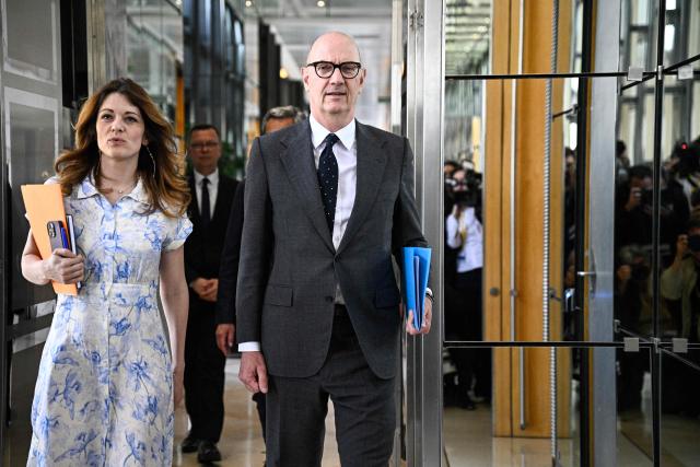 France's Government Spokesperson Maud Bregeon (L) and France's Economy and Finance Minister Roland Lescure arrive for a ministers meeting with fuel distributors at the Bercy finance ministry in Paris on April 9, 2026. (Photo by JULIEN DE ROSA / AFP)