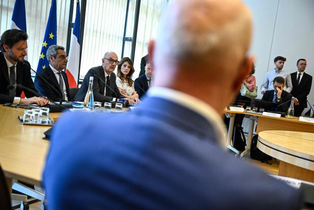 France's Trade Minister Serge Papin (2ndL), France's Economy and Finance Minister Roland Lescure (3rdL) and France's Government Spokesperson Maud Bregeon (4thL) attend a meeting with fuel distributors at the Bercy finance ministry in Paris on April 9, 2026. (Photo by JULIEN DE ROSA / AFP)