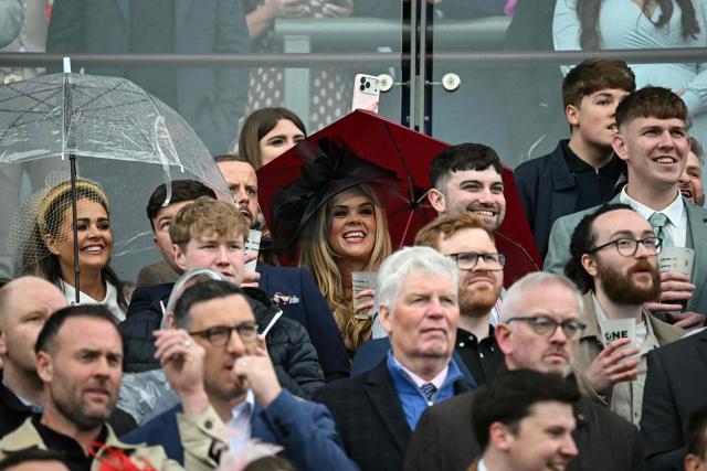 Racegoers watch the second race of the day on the opening day of the Grand National Festival horse race meeting at Aintree Racecourse in Liverpool, north-west England, on April 9, 2026. (Photo by Paul ELLIS / AFP)