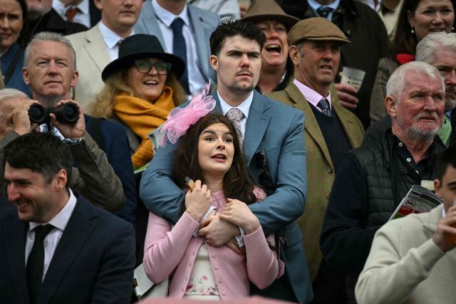 Racegoers watch the second race of the day on the opening day of the Grand National Festival horse race meeting at Aintree Racecourse in Liverpool, north-west England, on April 9, 2026. (Photo by Paul ELLIS / AFP)