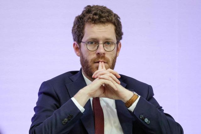 France's junior Minister for civil service David Amiel looks on during a press conference to present the plan to reduce absenteeism at work, in Paris on April 9, 2026. France's Health Minister confirmed to the National Assembly on April 1, 2026 that the government is preparing to announce measures to curb the current rise in sick pay, which is "no longer sustainable" for the National Health Service. This also includes making it easier for employers to monitor absenteeism and providing employers with guidelines on best practice regarding working conditions. (Photo by Ludovic MARIN / AFP)