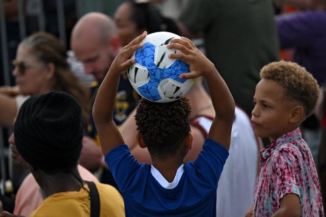 Children attend the Legends Football Tournament in Willemstad, Curacao, in the Dutch Caribbean, on April 8, 2026. (Photo by Raul ARBOLEDA / AFP)