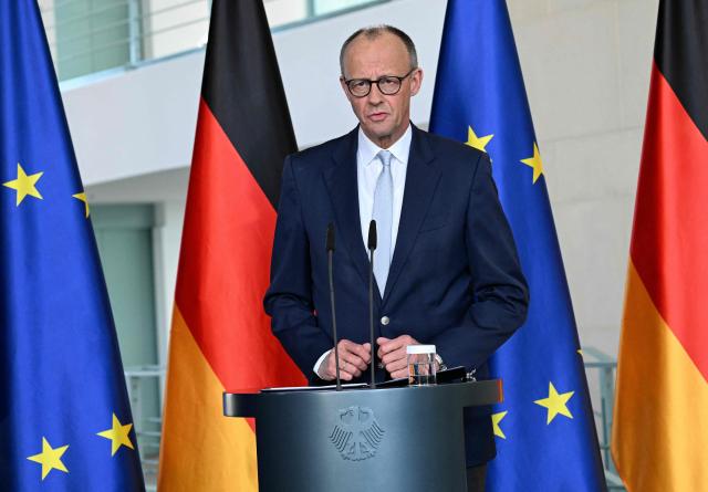 German Chancellor Friedrich Merz addresses a press conference on domestic and foreign policy issues at the Chancellery in Berlin on April 9, 2026. (Photo by RALF HIRSCHBERGER / AFP)