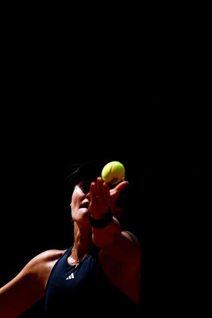 France's Kristina Mladenovic serves a ball during her women's singles match against Romania’s Carmen Andreea Herea during the Billie Jean King Cup play-offs between France and Romania, at Oeiras on the outskirts of Lisbon, on April 9, 2026. (Photo by FILIPE AMORIM / AFP)