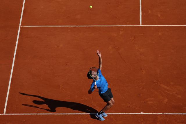 Spain's Carlos Alcaraz eyes the ball to return to Argentina's Tomas Martin Etcheverry during their Monte Carlo ATP Masters Series Tournament round of 16 tennis match on Court Rainier III at the Monte-Carlo Country Club in Roquebrune-Cap-Martin, south-eastern France on April 9, 2026. (Photo by Valery HACHE / AFP)