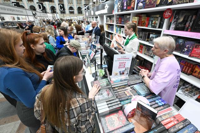 People buy books at the Non/Fiction book fair in Moscow on April 9, 2026. (Photo by Igor IVANKO / AFP)