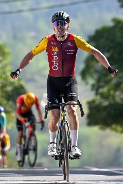 Team Cofidis' Spanish rider Alex Aranburu celebrates as he crosses the finish line to win the fourth stage of the Basque Country's Itzulia cycling tour, a 167.2 km race starting and finishing in Galdakao, on April 9, 2026. (Photo by ANDER GILLENEA / AFP)